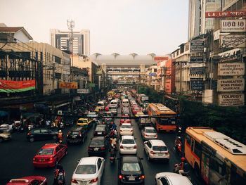 Traffic amidst buildings in city