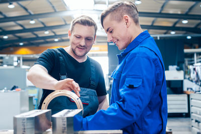 Man and woman working in factory