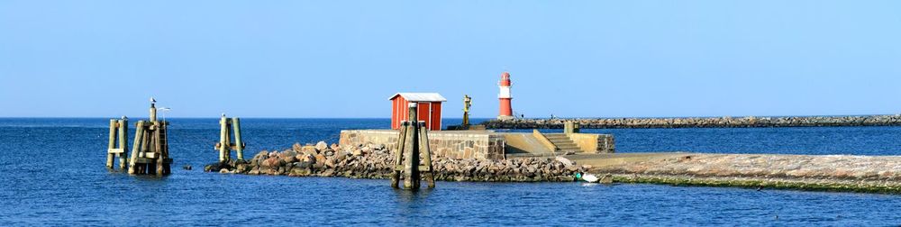 Scenic view of lighthouse against blue sky