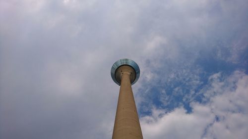 Low angle view of communications tower against sky