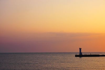 Scenic view of sea at sunset