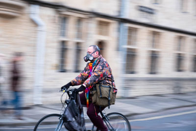 Man riding bicycle on street