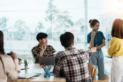 Group of business colleagues working at office