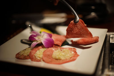 Close-up of beef in plate on table