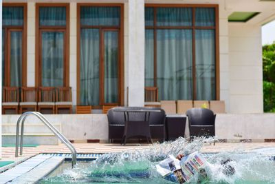 View of swimming pool by building