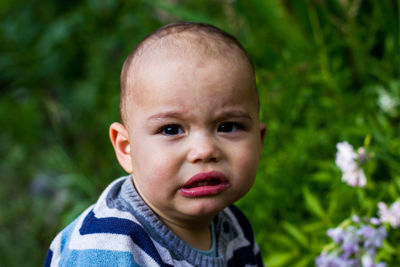 Cute little baby boy outdoors. chubby cheeks abd lips
