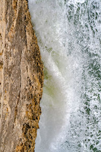 Sea waves splashing on rocks