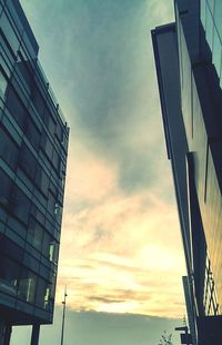 Low angle view of building against cloudy sky