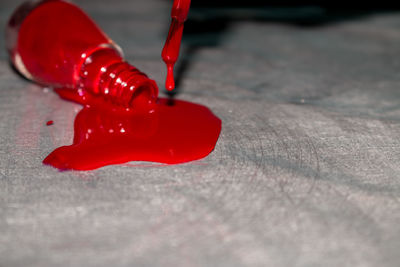 Close-up of red shoes on table