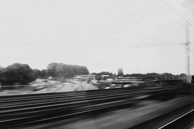 Train on railway tracks against clear sky