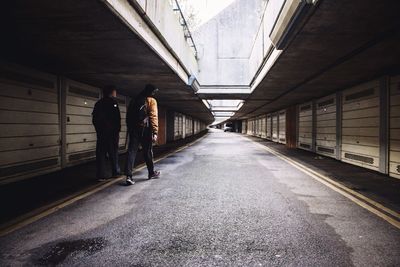 Full length of woman walking on road