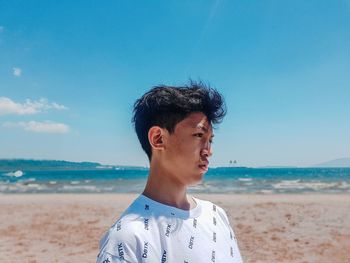 Portrait of young man on beach