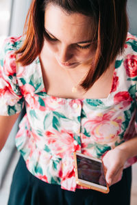 Midsection of woman holding bouquet