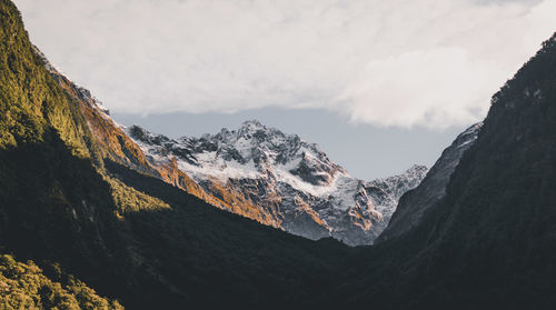 Scenic view of mountains against sky during winter