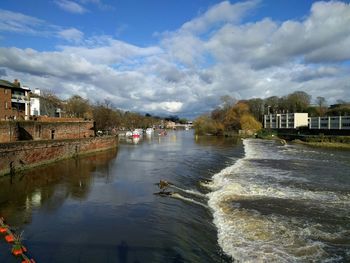 View of river with buildings in background