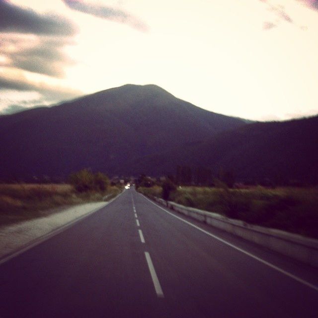 the way forward, road, transportation, diminishing perspective, road marking, vanishing point, mountain, country road, sky, empty road, empty, asphalt, tranquil scene, tranquility, mountain range, landscape, nature, street, beauty in nature, long