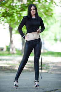 Portrait of young woman standing outdoors