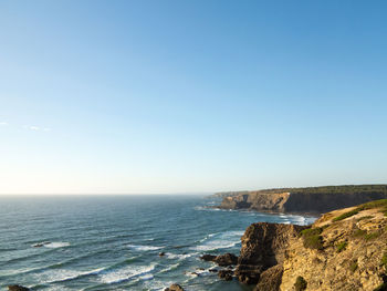 Scenic view of sea against clear sky