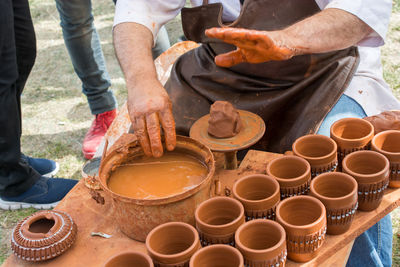 Midsection of potter making earthenware