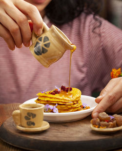 Midsection of man holding ice cream