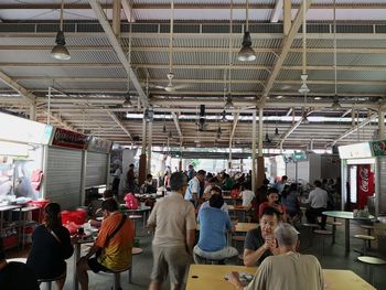 Rear view of people walking in train