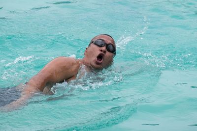 Man swimming in pool