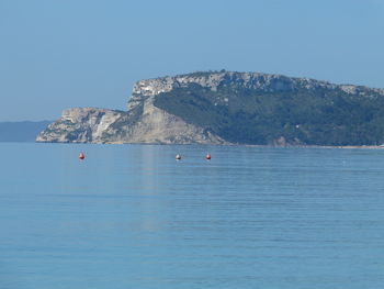 Scenic view of sea against clear blue sky