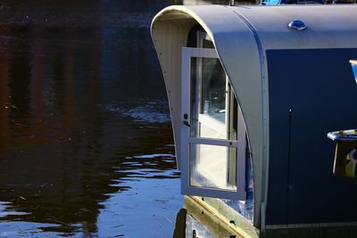 Reflection of metal boat in lake