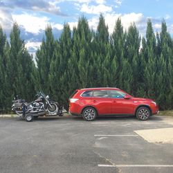 Vintage car on trees against sky