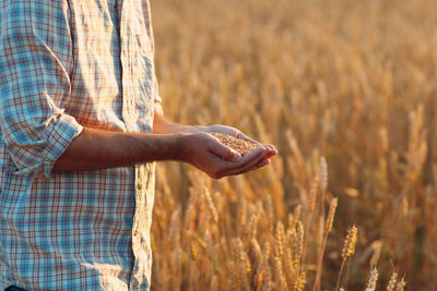 Midsection of man standing on land