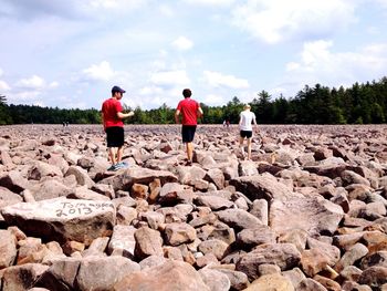 Full length of woman standing on rock