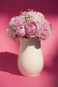 Midsection of bride holding bouquet