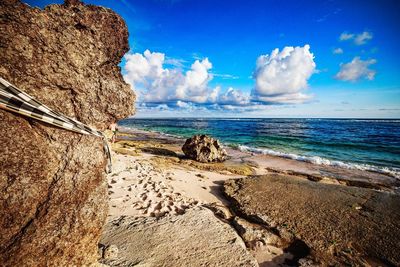 Scenic view of sea against cloudy sky