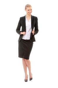 Portrait of a smiling young woman against white background