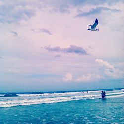 Scenic view of sea against cloudy sky