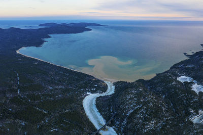 High angle view of beach against sky during sunset