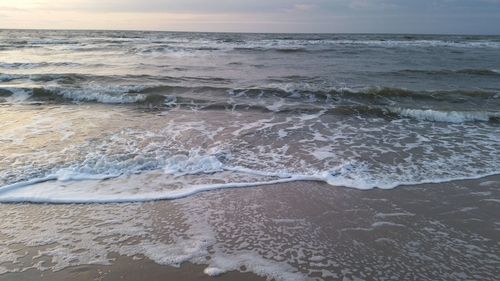 View of calm beach against the sky