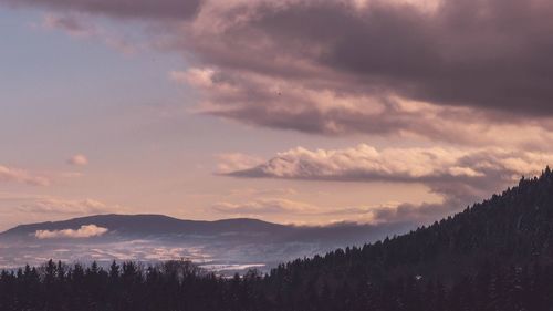 Scenic view of silhouette mountains against sky