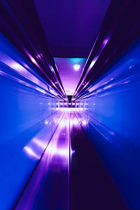 Low angle view of illuminated lights in tunnel