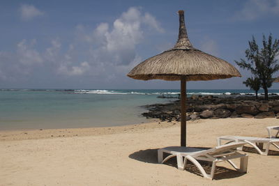 Scenic view of beach against sky