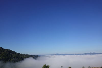 Scenic view of mountains against clear blue sky