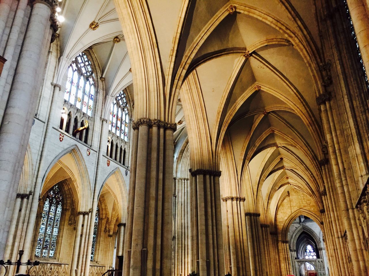 architecture, low angle view, built structure, arch, no people, religion, place of worship, spirituality, day, indoors, rose window