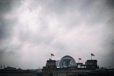Buildings in city against sky