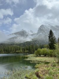 Scenic view of waterfall against sky