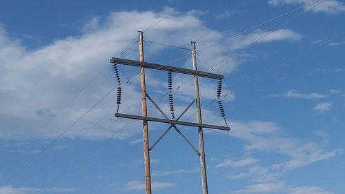 Low angle view of windmill against sky