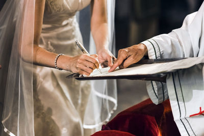 Midsection of woman working on table