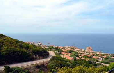 High angle view of road by sea against sky