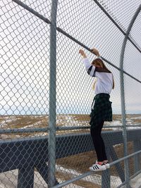 Chainlink fence seen through chainlink fence