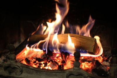 Close-up of burning candles on barbecue grill