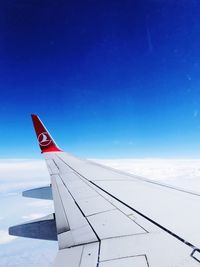 Airplane flying over blue sky